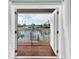 A view through a door from inside of the home to a porch over the water at 538 Crystal Dr, Madeira Beach, FL 33708