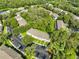 Aerial view of a multi-Gathering complex with parking and green spaces, nestled in a lush, wooded area at 5717 Fishhawk Ridge Dr, Lithia, FL 33547