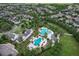 Stunning aerial view of the community pool, surrounding homes, and lush landscaping at 5717 Fishhawk Ridge Dr, Lithia, FL 33547