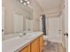 Bathroom features a single sink vanity with white countertop, tub, and shower at 5717 Fishhawk Ridge Dr, Lithia, FL 33547