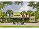 Inviting commercial building exterior with patio seating and lush landscaping, perfect for a vibrant community gathering space at 5717 Fishhawk Ridge Dr, Lithia, FL 33547