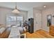 Dining room with hardwood floors, blinds and view of the front door at 5717 Fishhawk Ridge Dr, Lithia, FL 33547