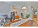 Bright dining area with hardwood floors and views into other living spaces at 5717 Fishhawk Ridge Dr, Lithia, FL 33547