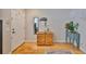 Welcoming entryway featuring hardwood floors, a mirror, and decorative accents at 5717 Fishhawk Ridge Dr, Lithia, FL 33547