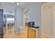 Hallway featuring hardwood floors leading to a dining room and other rooms at 5717 Fishhawk Ridge Dr, Lithia, FL 33547
