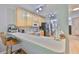 Bright kitchen features a breakfast bar, modern appliances, and ample counter space at 5717 Fishhawk Ridge Dr, Lithia, FL 33547