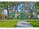 Image features playground with various climbing structures and slides for , perfect for outdoor fun and recreation at 5717 Fishhawk Ridge Dr, Lithia, FL 33547