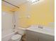 Bathroom featuring a tub, shower, sink, toilet and grey vanity at 5725 80Th N St # 301, St Petersburg, FL 33709