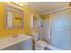Bathroom showcasing a glass-door shower, modern vanity, and mirrored cabinet at 5725 80Th N St # 301, St Petersburg, FL 33709