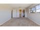 Bedroom with a closet and doorways with neutral color walls and carpet at 5725 80Th N St # 301, St Petersburg, FL 33709
