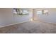 Bright bedroom featuring two windows allowing natural light to fill the space at 5725 80Th N St # 301, St Petersburg, FL 33709