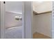 Walk-in closet with tiled floor, clothes rod and a view into the bedroom at 5725 80Th N St # 301, St Petersburg, FL 33709