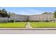 Well-maintained condo building with mature landscaping and ample parking at 5725 80Th N St # 301, St Petersburg, FL 33709