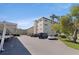 Exterior angle shot of condo building showing covered parking spaces at 5725 80Th N St # 301, St Petersburg, FL 33709