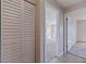 Hallway with a closet and an open doorway to a bedroom at 5725 80Th N St # 301, St Petersburg, FL 33709