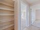 Hallway with a closet and an open doorway to a bedroom at 5725 80Th N St # 301, St Petersburg, FL 33709
