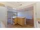 Open kitchen with island features a view of the living area, promoting seamless interaction and modern living at 5725 80Th N St # 301, St Petersburg, FL 33709