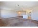 Bright living room shows the open floor plan with a view of the adjacent kitchen and breakfast bar at 5725 80Th N St # 301, St Petersburg, FL 33709