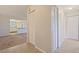 Hallway view of living space and kitchen at 5725 80Th N St # 301, St Petersburg, FL 33709