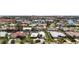 Stunning aerial view showcasing a waterfront community with luxurious homes, private docks, and lush landscaping at 5884 51St S St, St Petersburg, FL 33715