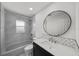 Modern bathroom with a shower-tub combo, sleek vanity, and elegant fixtures at 5884 51St S St, St Petersburg, FL 33715