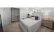 Cozy bedroom with neutral tones, featuring plush bedding and matching nightstands, with closet access at 5884 51St S St, St Petersburg, FL 33715