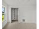 Bright bedroom featuring neutral carpet and an open closet with shelving at 5884 51St S St, St Petersburg, FL 33715
