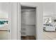 Organized closet with built-in shelving, providing ample storage space between the bedroom and living area at 5884 51St S St, St Petersburg, FL 33715