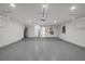 Spacious garage featuring an epoxy floor, water heater and garage door openers at 5884 51St S St, St Petersburg, FL 33715