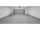 Spacious garage featuring an epoxy floor and an automatic garage door at 5884 51St S St, St Petersburg, FL 33715