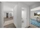 Bright hallway showcasing access to the powder room, living space and a sunlit room at 5884 51St S St, St Petersburg, FL 33715