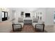 Bright and airy living room with comfortable seating, flowing into the dining area and offering pool views at 5884 51St S St, St Petersburg, FL 33715