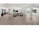 Bright, open-concept living room featuring modern decor, lots of natural light, and views of the pool at 5884 51St S St, St Petersburg, FL 33715