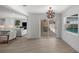 Bright living room with sliding glass doors leading to a screened pool area at 5884 51St S St, St Petersburg, FL 33715