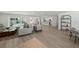 Open-concept living room blending seamlessly with the kitchen and pool views, perfect for entertaining at 5884 51St S St, St Petersburg, FL 33715