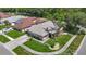 Well-maintained home with manicured lawn and decorative landscaping in a quiet suburban neighborhood at 6001 Lemon Tree Ct, Tampa, FL 33625