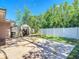Fenced backyard with a patio, a storage shed and lawn perfect for outdoor enjoyment at 6001 Lemon Tree Ct, Tampa, FL 33625