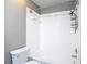 Bathroom with a white shower and toilet at 6001 Lemon Tree Ct, Tampa, FL 33625
