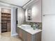 Contemporary bathroom with a unique vessel sink, modern vanity, and stylish fixtures, and walk-in closet at 6001 Lemon Tree Ct, Tampa, FL 33625