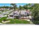 Charming single-story home with a well-manicured lawn and mature palm trees in a quiet neighborhood at 6001 Lemon Tree Ct, Tampa, FL 33625