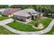 Well-maintained home featuring beautiful landscaping, a charming facade, and a welcoming entryway at 6001 Lemon Tree Ct, Tampa, FL 33625