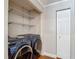 Laundry room with a washer and dryer and wire shelving at 6001 Lemon Tree Ct, Tampa, FL 33625
