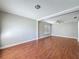 Bright living room featuring wood floors and modern ceiling fan at 6001 Lemon Tree Ct, Tampa, FL 33625