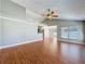 Bright and spacious living area with wood-look floors, vaulted ceilings and kitchen access with view to the dining area at 6001 Lemon Tree Ct, Tampa, FL 33625