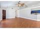Spacious living area with wood-look flooring, vaulted ceilings, and an open view of the modern kitchen at 6001 Lemon Tree Ct, Tampa, FL 33625