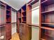 Walk-in closet with wood shelving and drawers at 6001 Lemon Tree Ct, Tampa, FL 33625