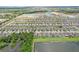 Panoramic aerial perspective of a sprawling residential area featuring numerous homes, lakes and greenery at 636 Chatham Walk Dr, Ruskin, FL 33570