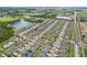 A sprawling residential neighborhood is captured from an aerial view, showcasing well-maintained lawns and roadways at 636 Chatham Walk Dr, Ruskin, FL 33570