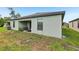 Back exterior featuring a covered patio and green space at 636 Chatham Walk Dr, Ruskin, FL 33570