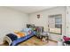 Bright bedroom with hardwood floors and natural light at 636 Chatham Walk Dr, Ruskin, FL 33570